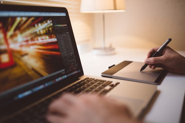 Man editing a picture on iMac