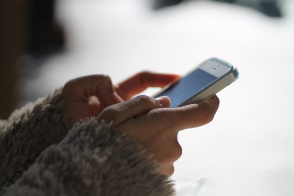 Woman using her iPhone