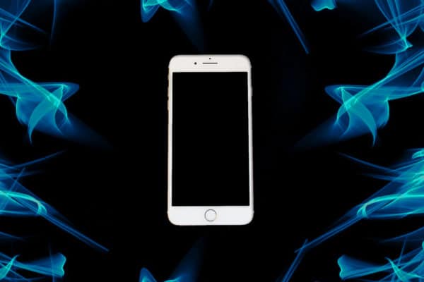 iPhone on a coloured smoke background