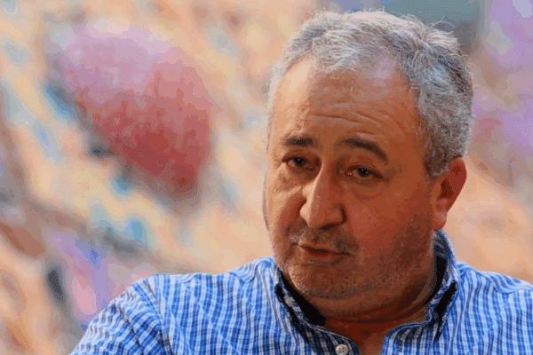 Man giving an interview on camera