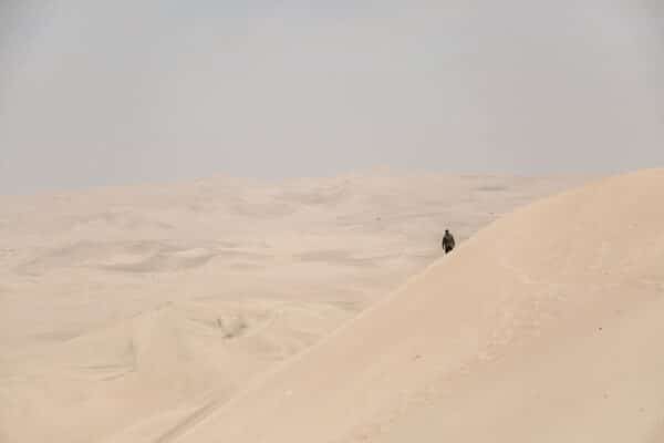 Man walking through the dessert