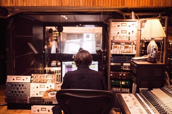 Producer in a studio doing sound design