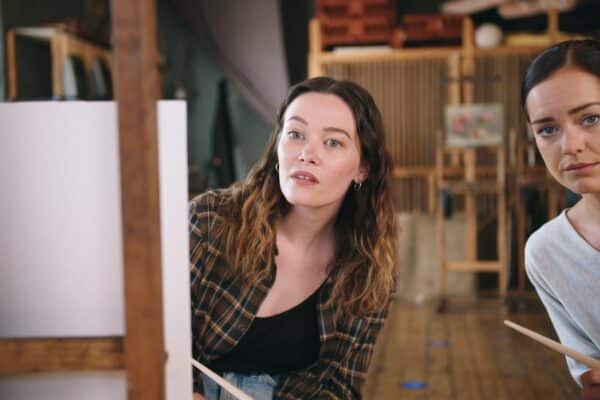 women looking at attractive man