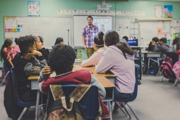 students listening to a teacher