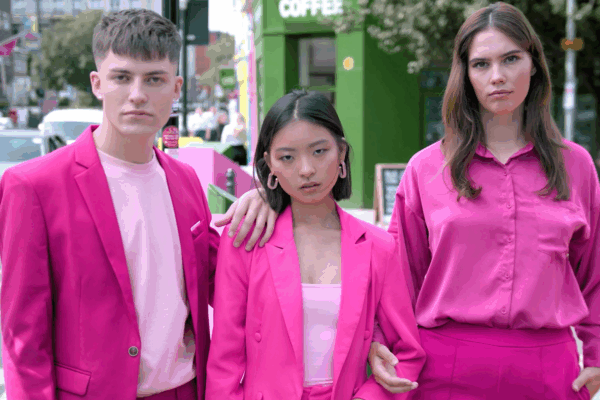 three people looking at the camera, dressed in pink for a lightricks social media ad