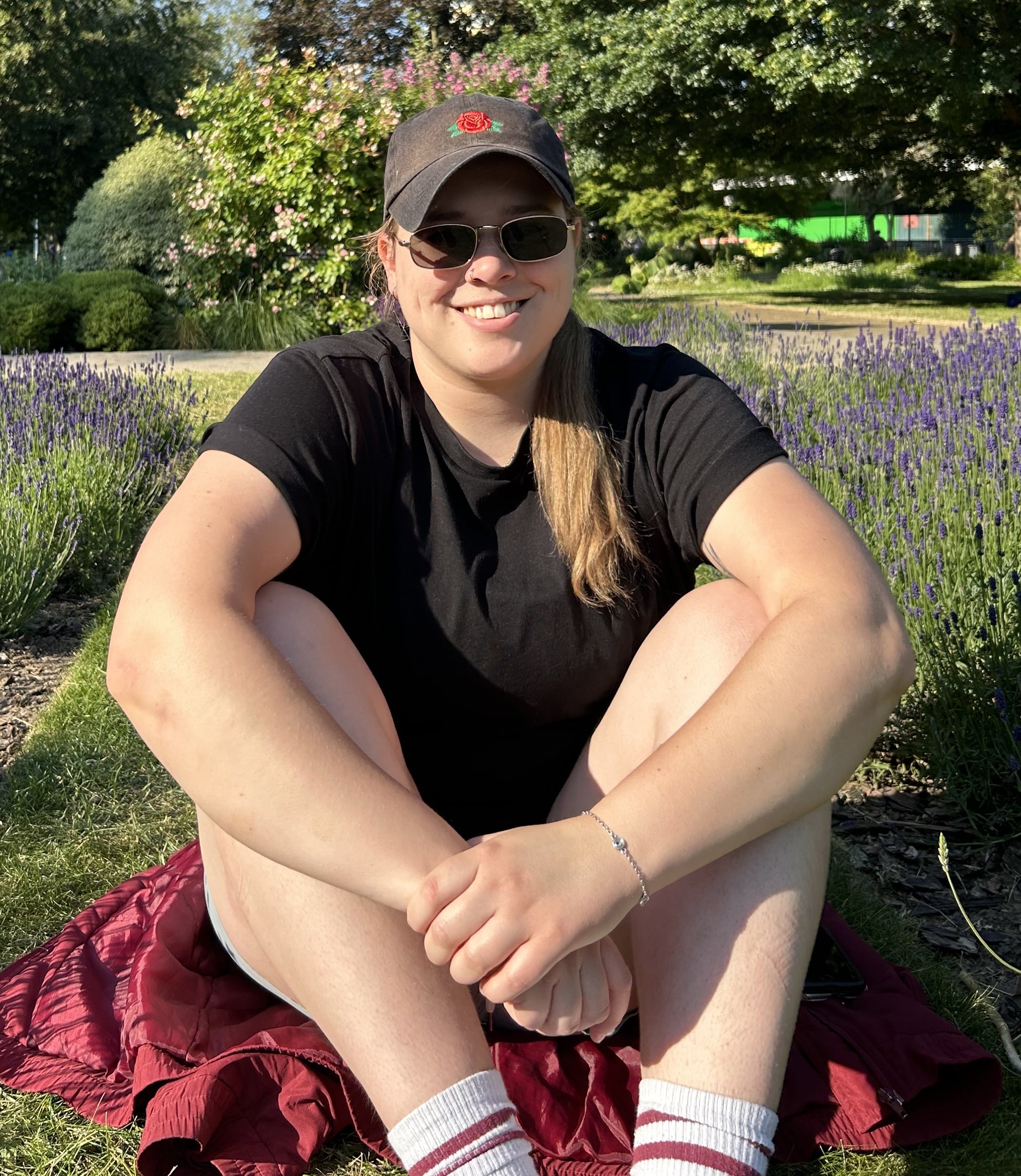 Woman sat near flowers