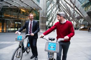 Men using city bikes