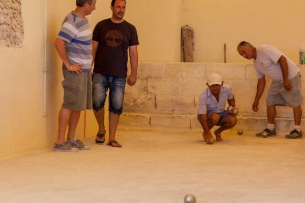 A group of men playing Gozo