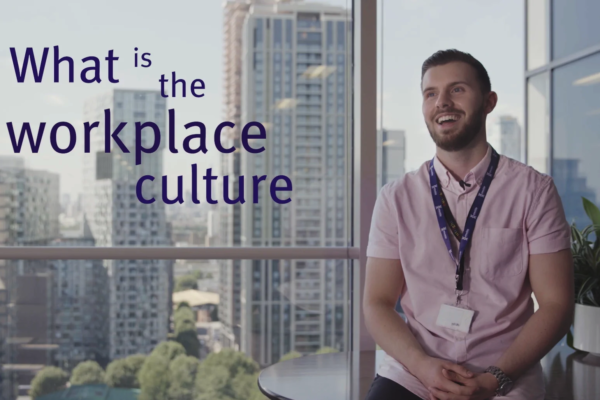 Man smiling and on-screen text reading 'What is the workplace culture?'