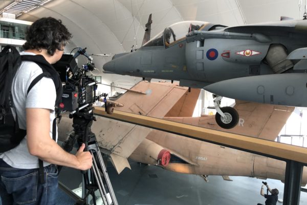 Cameraman shooting an airplane at RAF museum