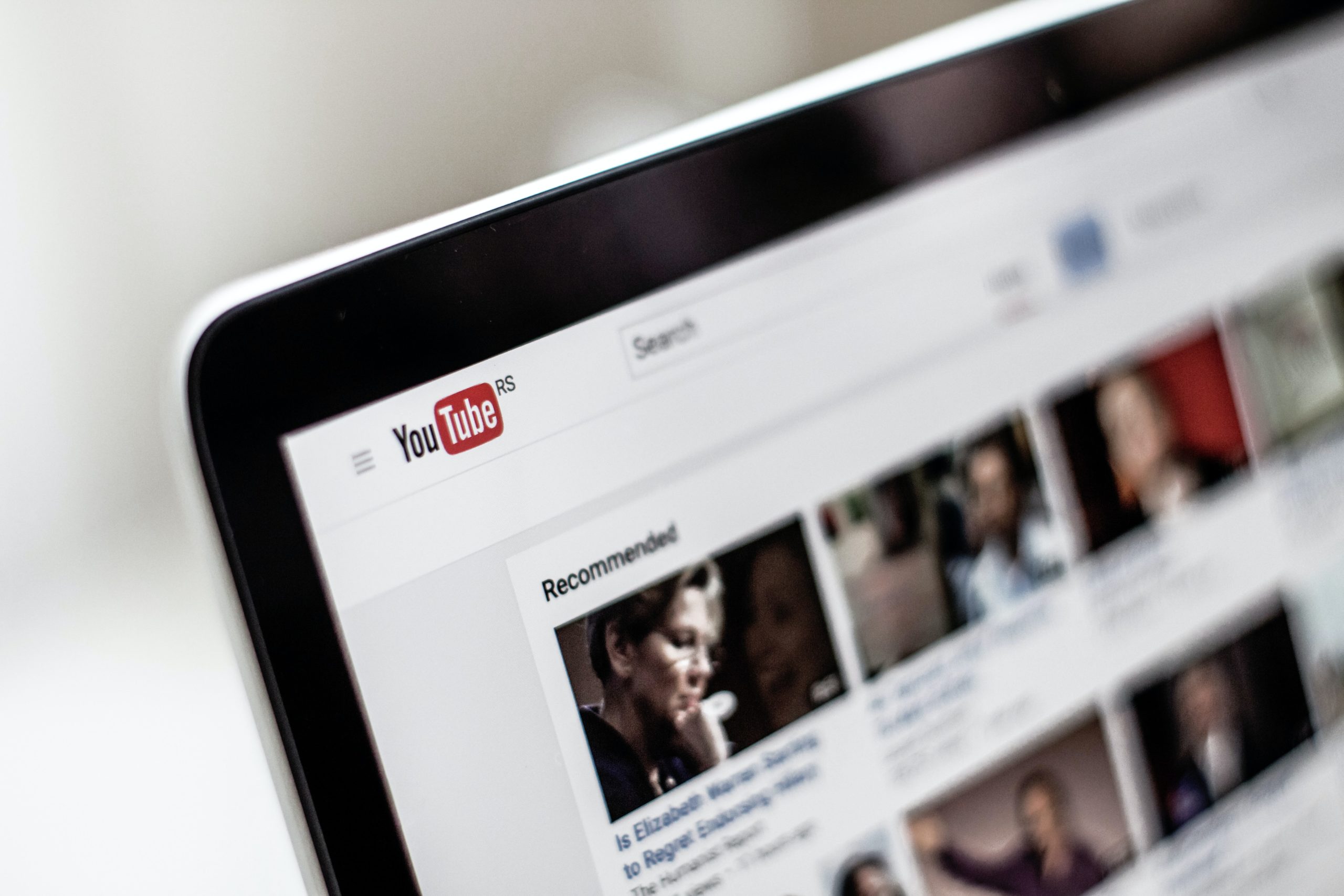 a photograph of youtube home screen on a computer