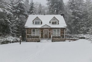 A photo of a house in the snow